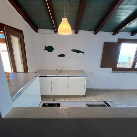 Casa de Férias Bilocale Acquamarina Presso I Nidi Dei Cormorani *